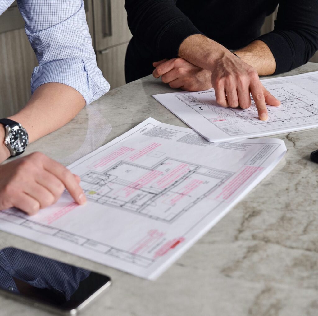 contempo architectural and interior designers discussing blueprints