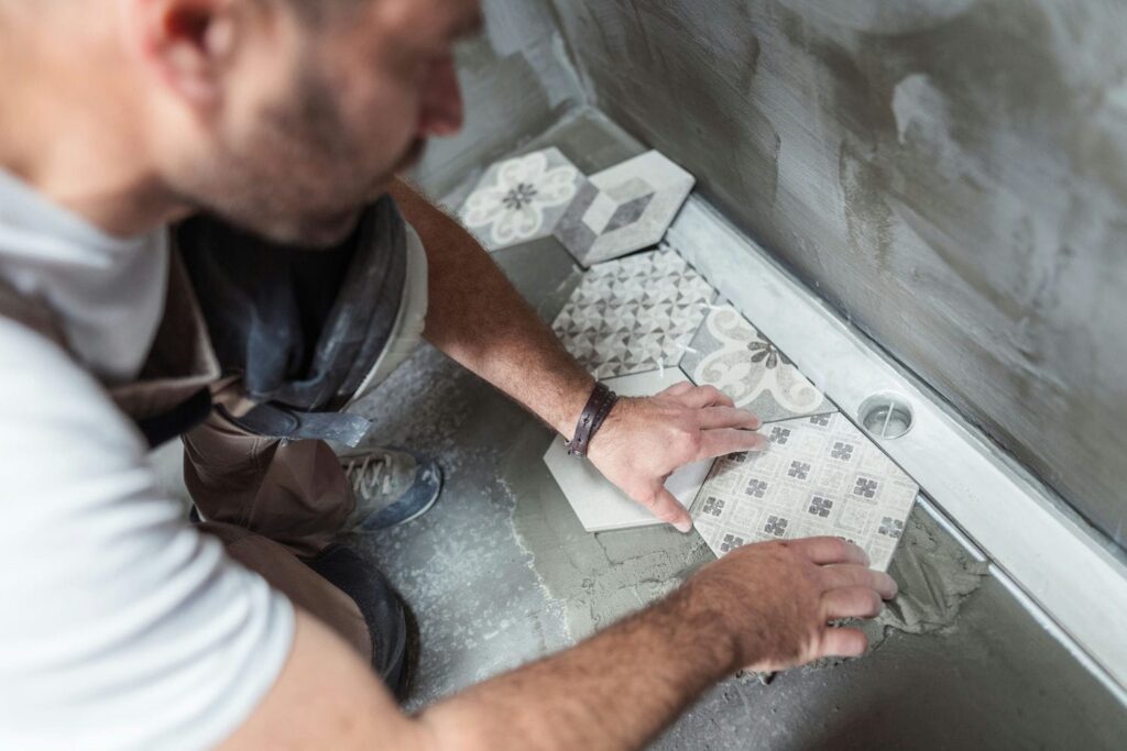 installing bathroom floor in Toronto condo renovation