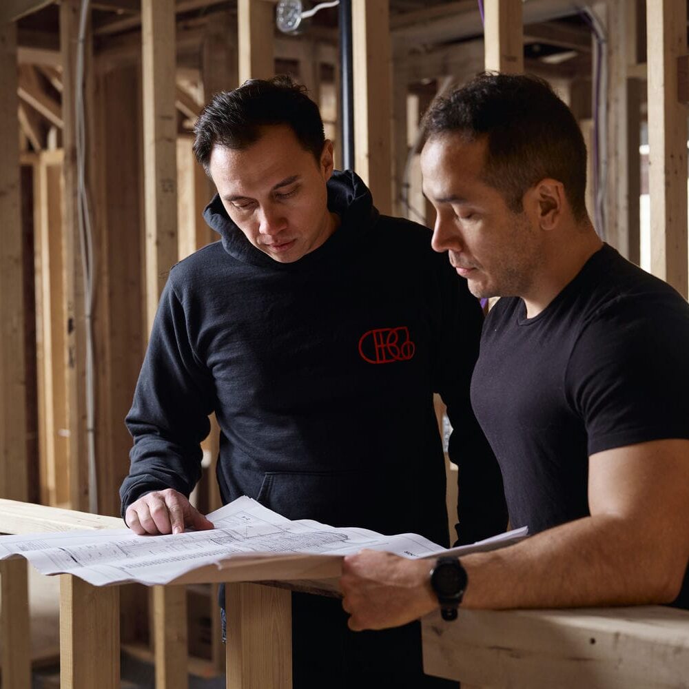 Contempo foudners reviewing building plans
