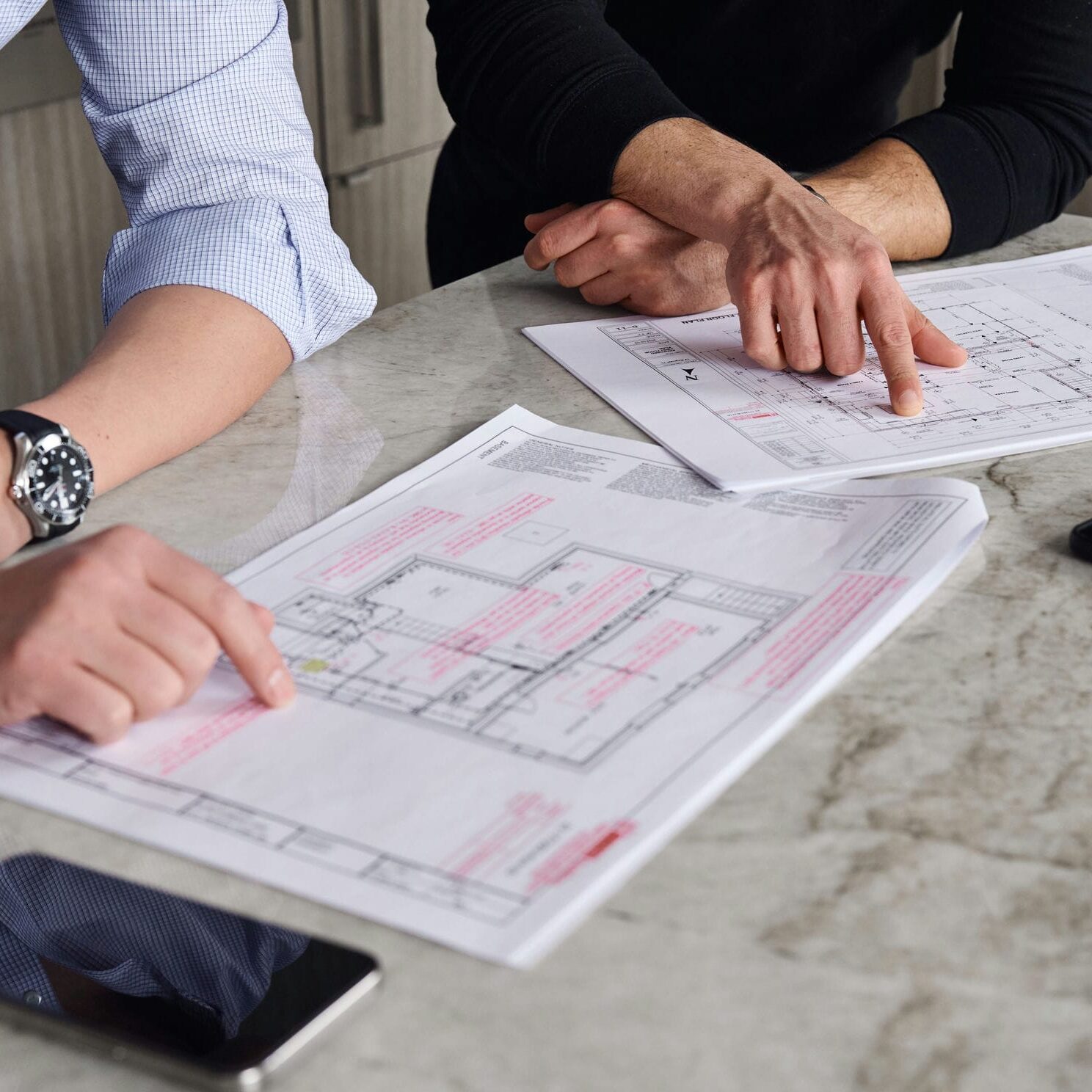 architectural designers reviewing home renovation plans