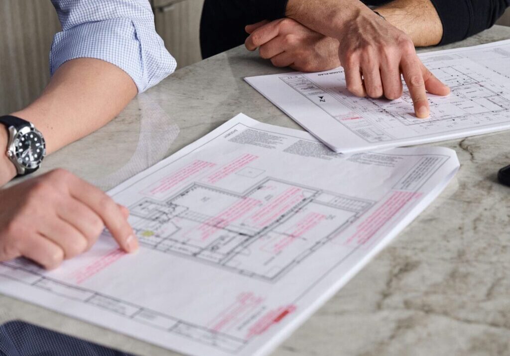 contempo architectural and interior designers discussing blueprints contempo architectural and interior designers discussing blueprints