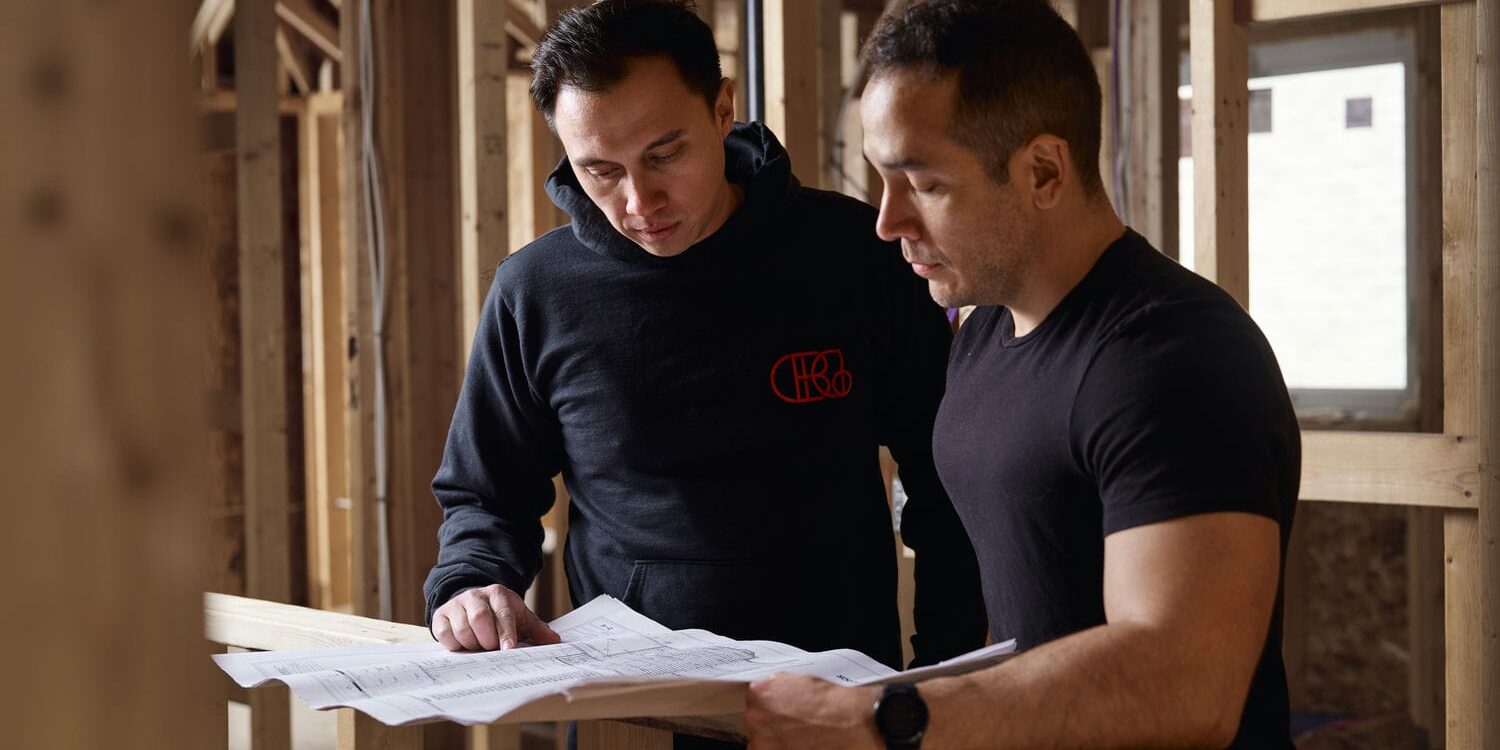 contempo architectural designers reviewing blueprints